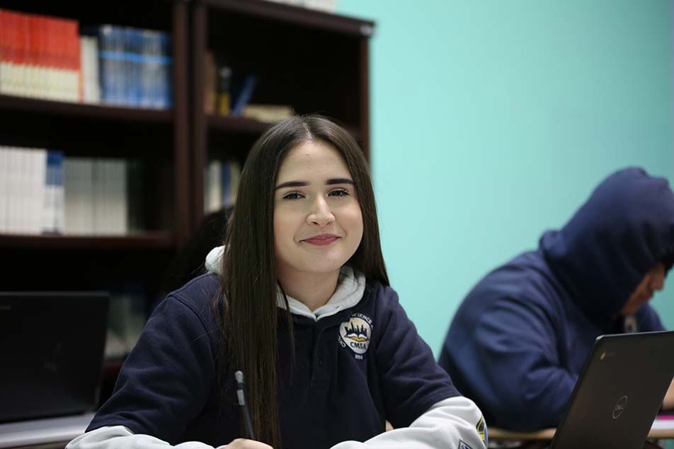students and teacher working in classroom